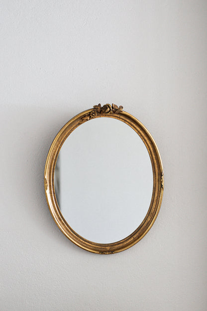 Vintage French Oval Mirror with Gilt Floral Motif