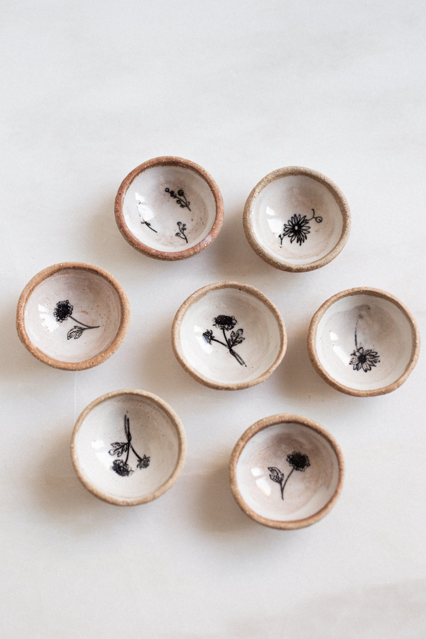 Petite Pair of nesting Ceramic Dishes w/ Floral inprint