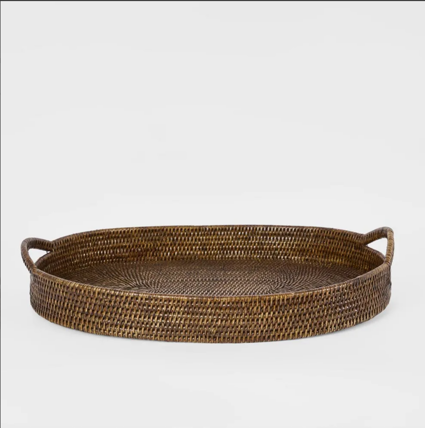 The Oval Rattan Tray in Antique Brown